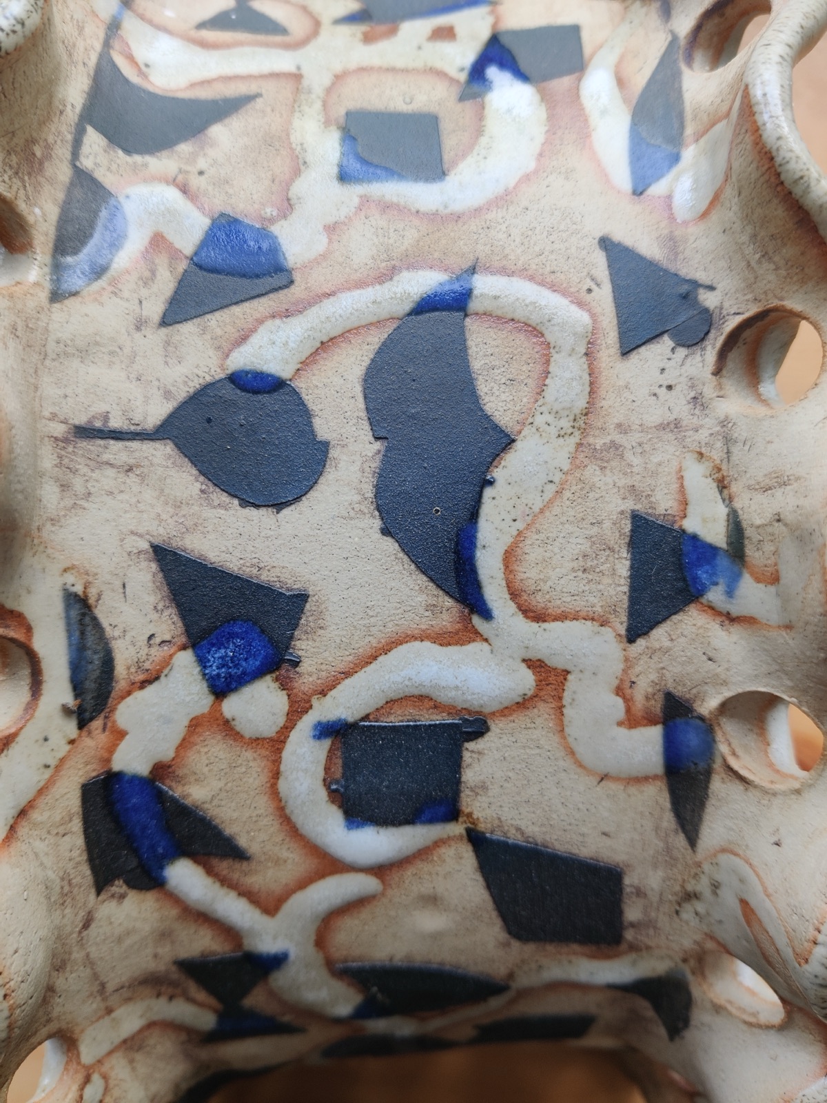 Slip-decorated ceramic detail in blue and black